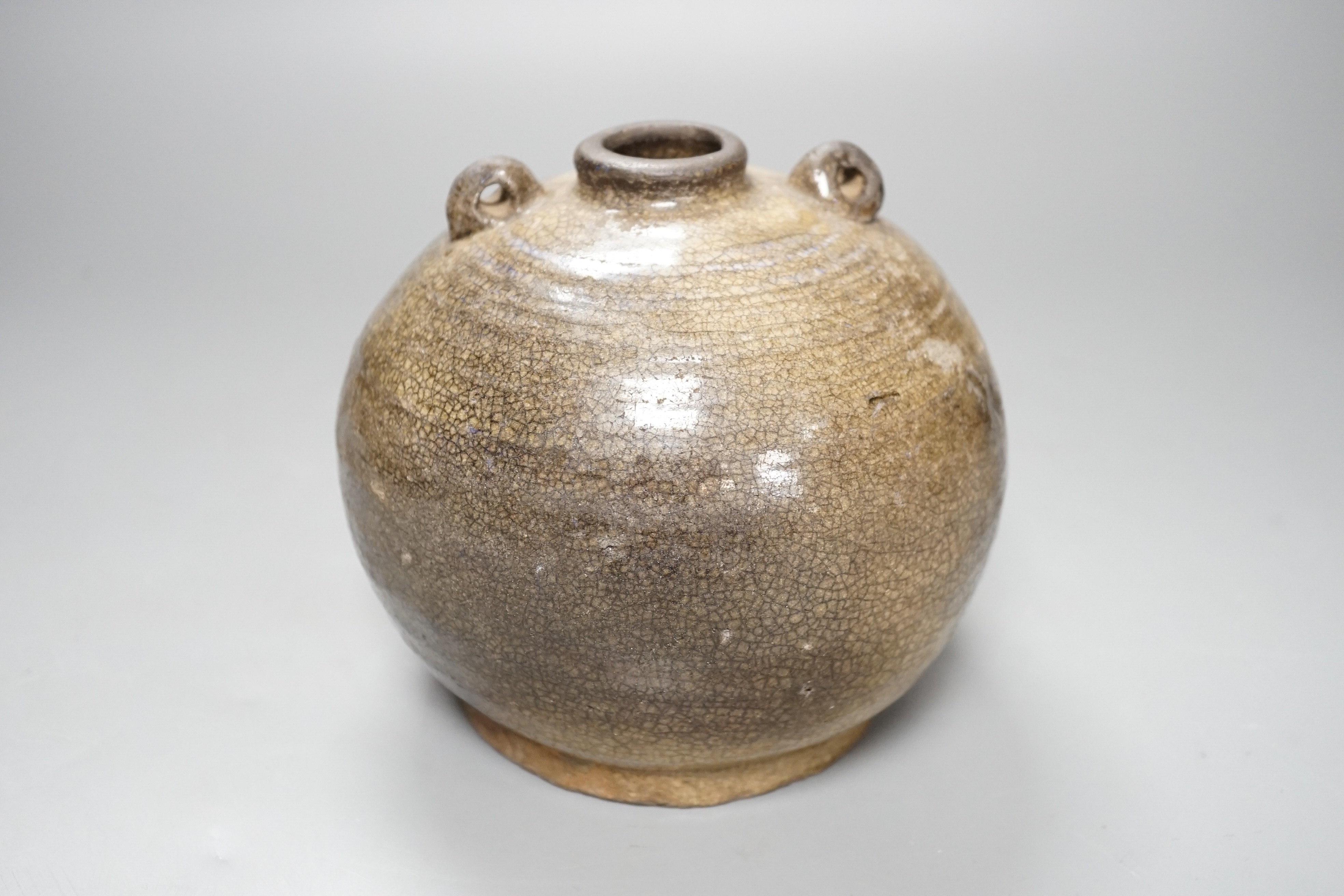 A South East Asian two-handled stoneware jar, possibly Annamese, 15th/16th century, 14cm